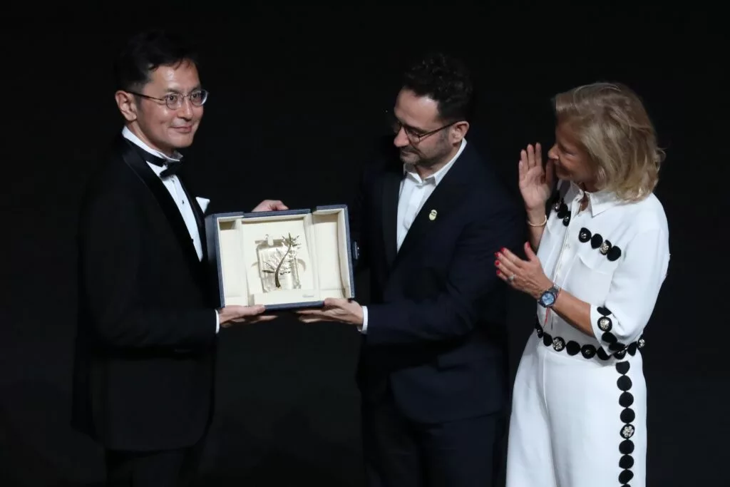 goro miyazaki accepting an honorary palme d'or